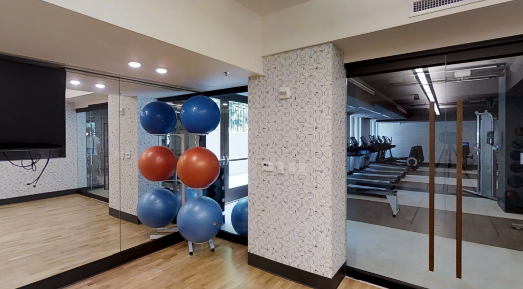 Park Van Ness | Spacious fitness center with private yoga and stretching studio and outdoor workout space